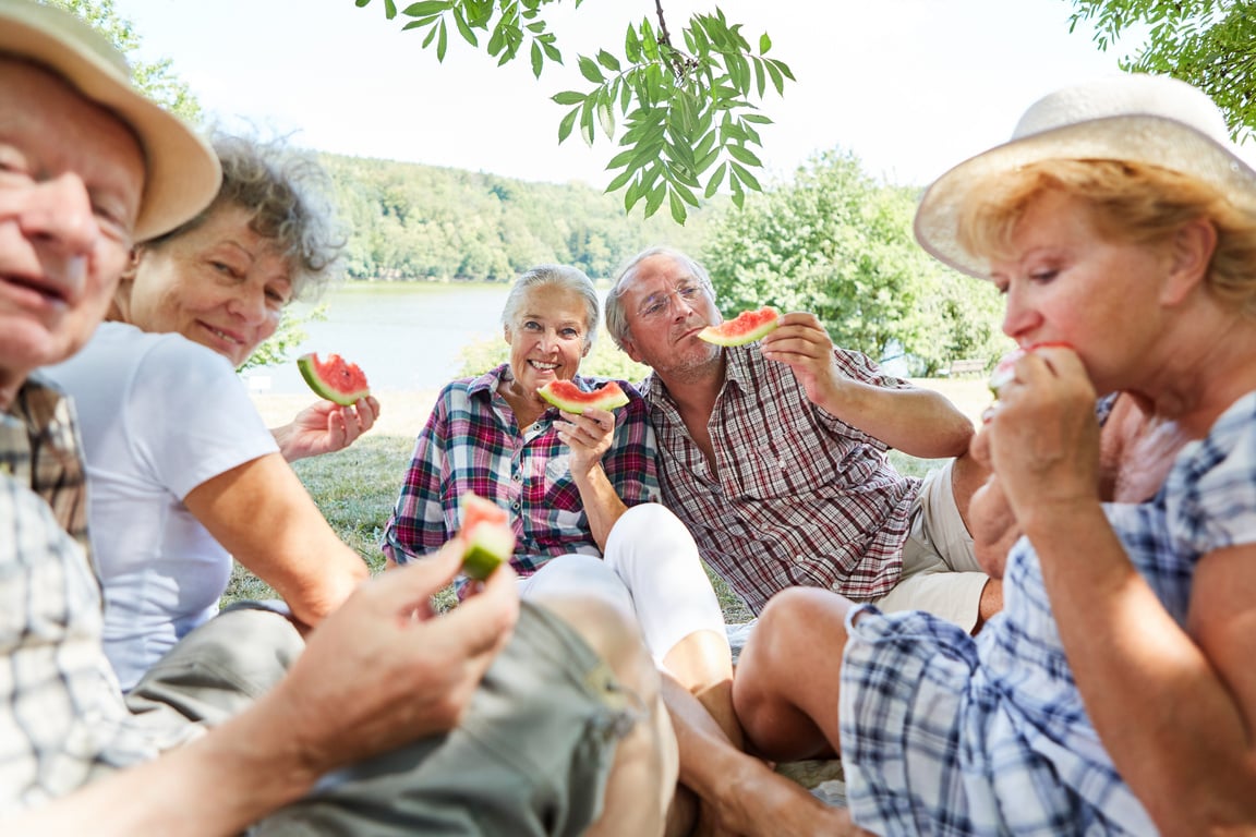 Senior Group Eating Melon